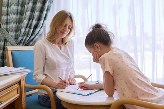 Child girl at session with social worker, school psychologist in an office. Child psychology, professional help, mental health of children, conversation between counselor and preteen girl