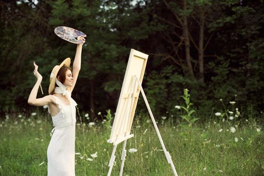 cheerful woman outdoors drawing art landscape hobby. High quality photo