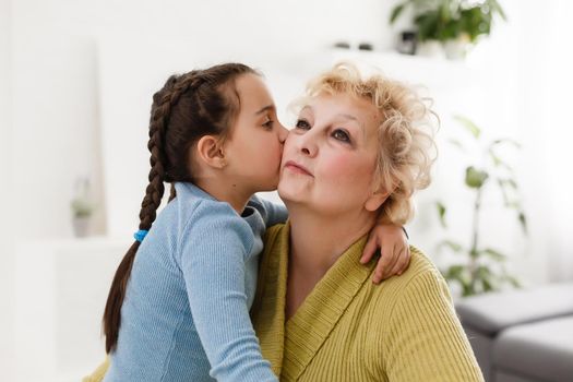 Grandmother and granddaughter portrait, embraced