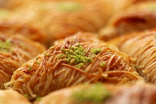 Close up photo of Turkish Baklava dessert with honey and nuts