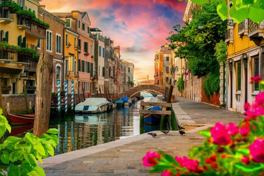 Boats in narrow venetian water canal, Italy