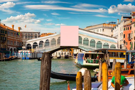 Rialto bridge and gondolas in Venice, Italy