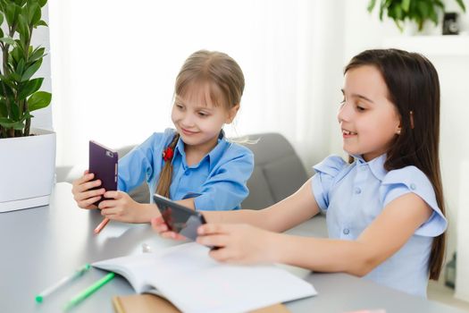 two little girls studying online. Distance Learning Online, e-learning, concept