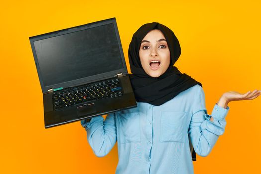 cheerful woman laptop posing technology internet isolated background. High quality photo