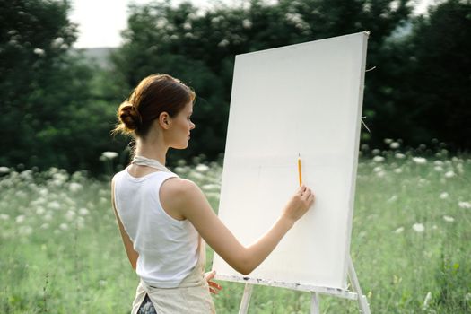 woman artist creative drawing landscape nature hobby. High quality photo