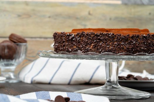 Chocolate cake with chocolate powder on top. High quality photo