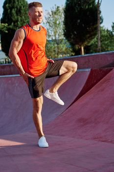 sports man on the playground in the park workout. High quality photo