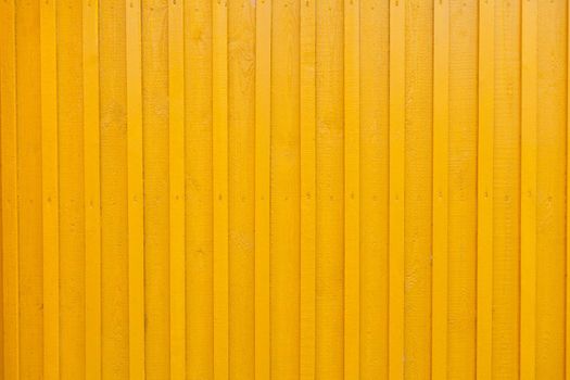 Yellow Wooden Tabby Textured wall Background. wall of the wooden house is painted yellow. painted vertical yellow wooden rendering wall background. wall design