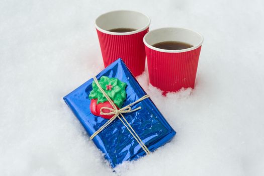 Gift, winter background - snow, two cups of coffee