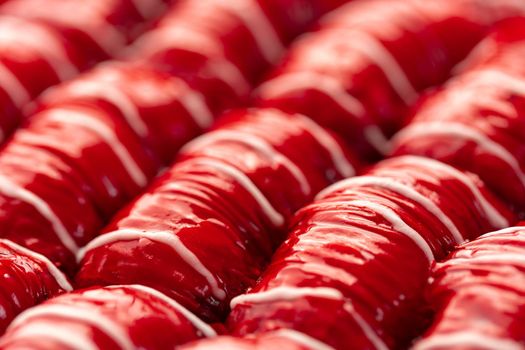 Red colored Turkish dessert baklava placed in rows, for background