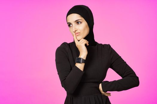 funny muslim clock technology posing pink background. High quality photo
