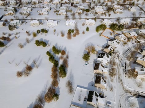 Panoramic top view on snow covered residential district home complex winter day