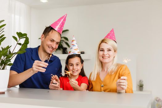 Happy family celebrating birthday via internet in quarantine time, self-isolation and family values, online birthday party