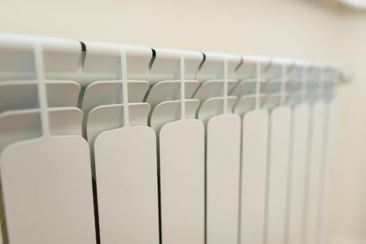 Close-up of white radiator heater in apartment