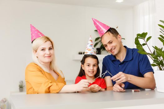 Happy family celebrating birthday via internet in quarantine time, self-isolation and family values, online birthday party