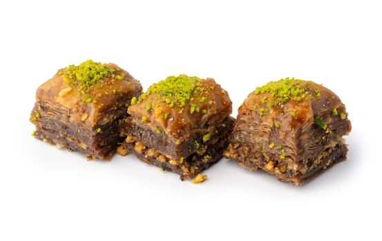 Turkish sweet pastry baklava isolated on white background, close up