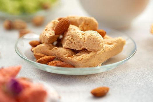 Close up photo of colorful Turkish halva sweets on gray surface