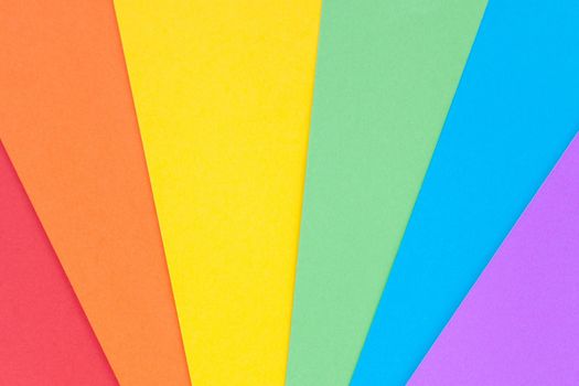 Paper with lgbt colors as a background. Rainbow colors. Pride community.