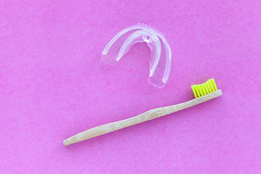 bamboo tooth brush. . Teeth Whitening Accelerator. Dental Bleaching System Flat lay composition space for text on pink background, top view