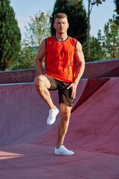 sports man on the playground in the park workout. High quality photo