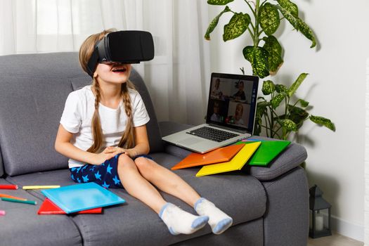 Young little girl with VR virtual reality glasses