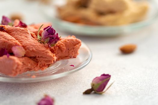 Close up photo of colorful Turkish halva sweets on gray surface