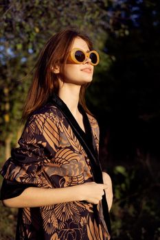 woman wearing sunglasses outdoors posing fashion. High quality photo