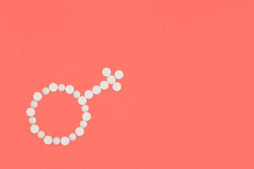 Medical background with pills. Female contraception concept. Gender symbol made from white pills or tablets on pink background. Copy space. Flat lay.
