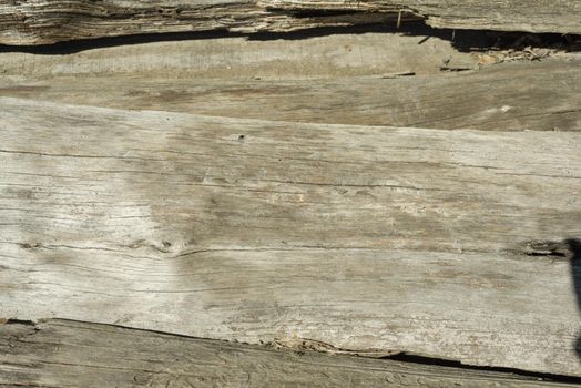 The old wood texture with natural patterns with cracked color, background.