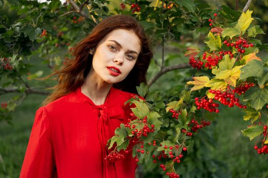 cheerful woman eating berries outdoors fresh air. High quality photo