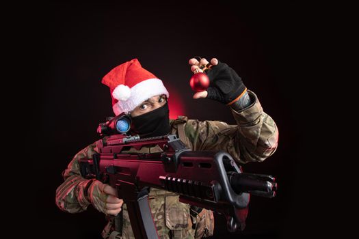 the man in a military uniform with a gun in hand Christmas toy