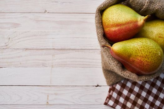 pears on wooden table agriculture vitamins close-up. High quality photo