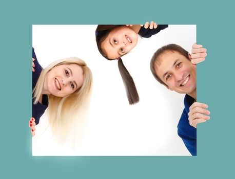 Big happy family with blue blank board in hands for advertisement isolated