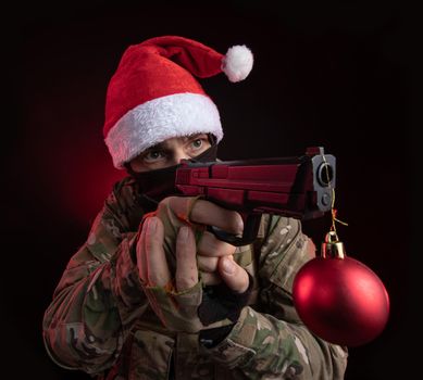 the man in a military uniform with a gun in hand Christmas toy