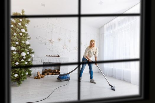 wiew through the window, Christmas Tree on background, winter holiday concept