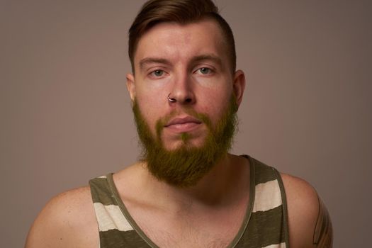 national bearded man in a striped jersey hipster tattoos on his arms. High quality photo