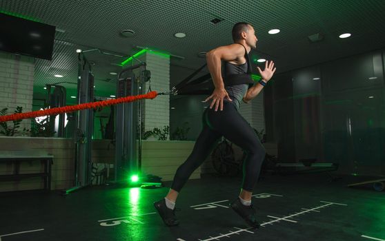 the man engaged in the gym