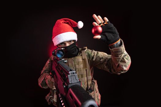 the man in a military uniform with a gun in hand Christmas toy