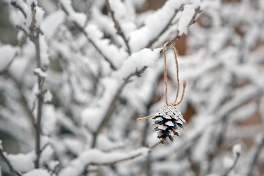 branches with snow and christmas tree cones. winter background