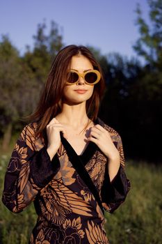 fashionable woman in sunglasses outdoors summer glamor. High quality photo