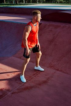 sports man doing exercises on the sports field fitness. High quality photo