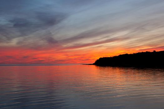 Beautiful cloudscape landscape sunset from the beach, clouds rays. red sunset and clouds