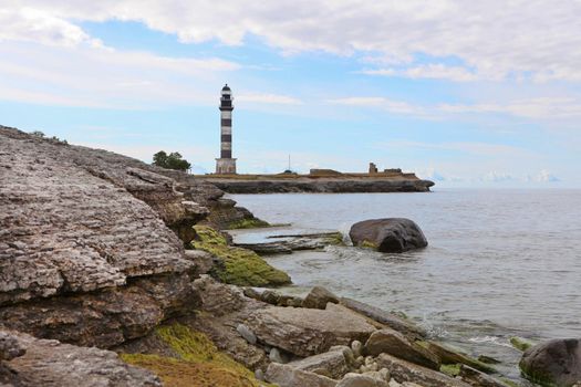 Lighthouse and hause on the small island in the Baltic Sea. Architecture on the Osmussaar, Estonia, Europe.