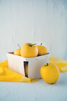 yellow apples at the basket on white background - Symbolic image. Concept for healthy nutrition. Front view.