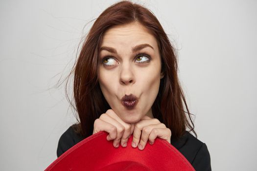 funny woman dressed as a witch red hat black lipstick halloween. High quality photo