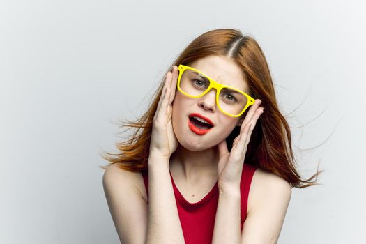 pretty woman yellow glasses hairstyle fashion close-up. High quality photo