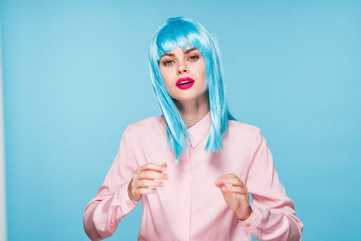 cheerful glamorous woman in pink shirt blue wig makeup model. High quality photo