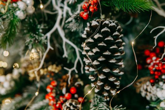 Balloons and handmade decorations on the Christmas tree close-up. Christmas background.