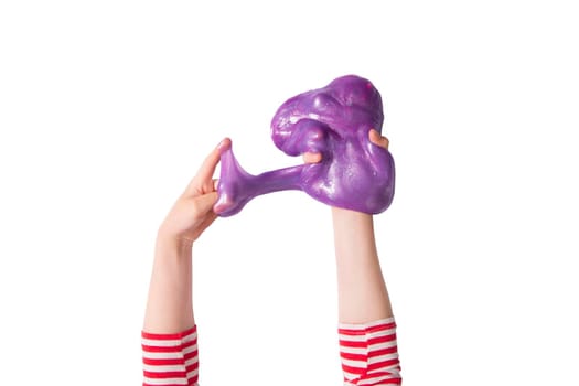 Teenager girl hands and purple shiny slime. Child girl plays with slime isolated on white. Home educational games or DIY concept. Top view, flat lay banner.