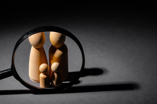 Wooden little figures of people close up. Family concept